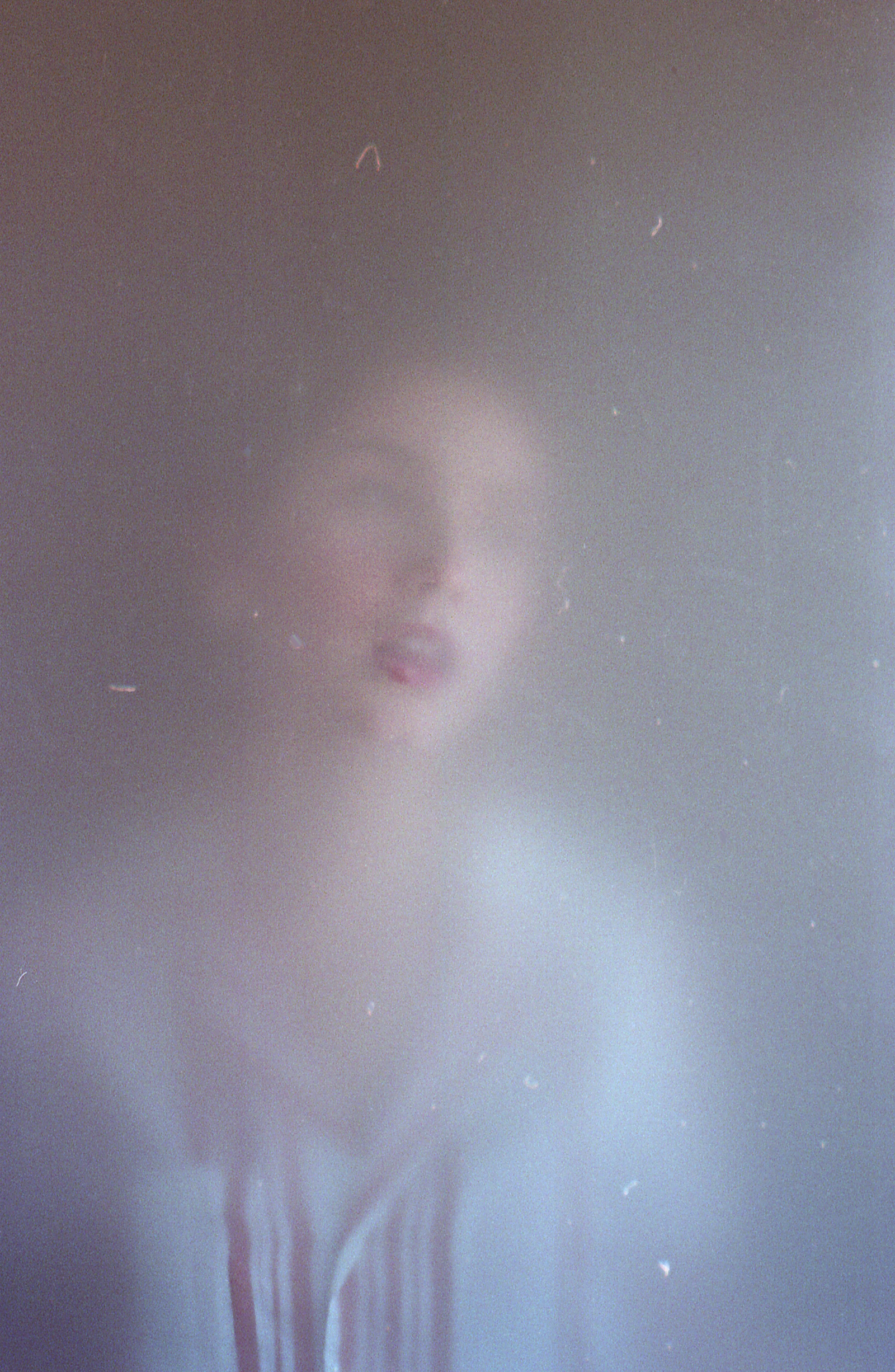 Film Photo of Miranda Valdez a model captured by photographer Ivan Beoulve. The image has a soft dreamy quality with a blurred background and a focused subject.